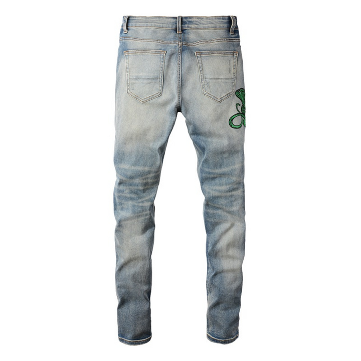 Amiri Luxus Slim Fit Snake Applikations Blue Jeans für Herren – Stylischer Denim