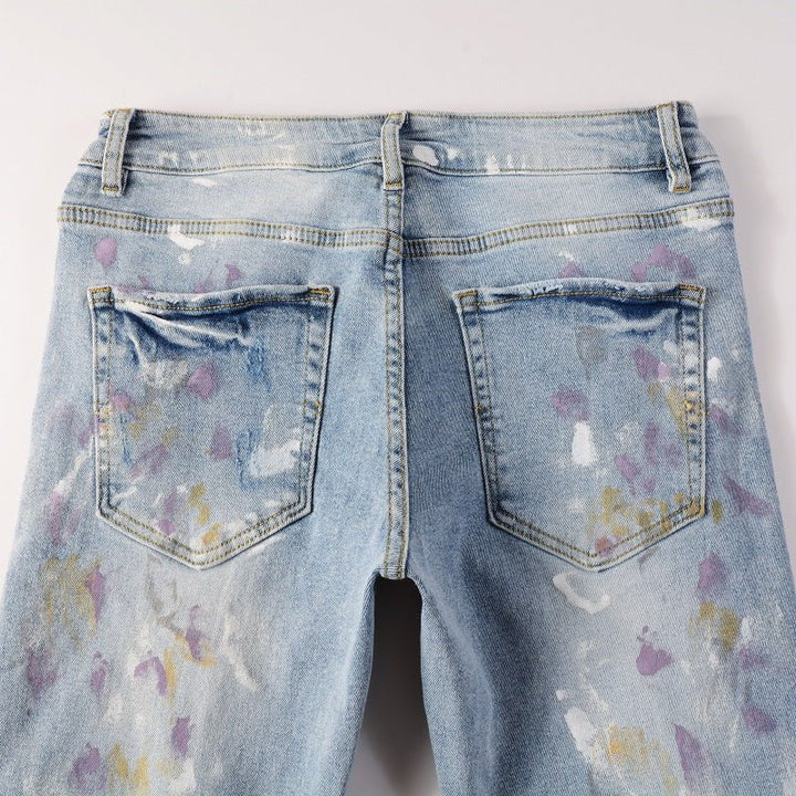 Amiri Herren Designer Jeans mit Farbspritzern – Stylische Blaue Denim Hose