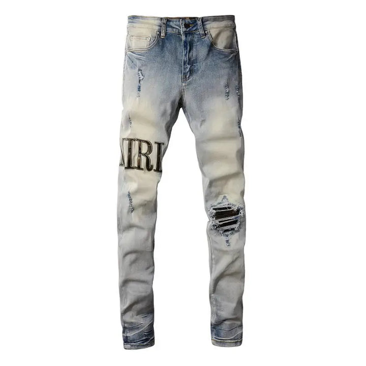 Amiri Camo Logo Jeans: Stylische Designer Stretch Denim Hose mit Tarnmuster