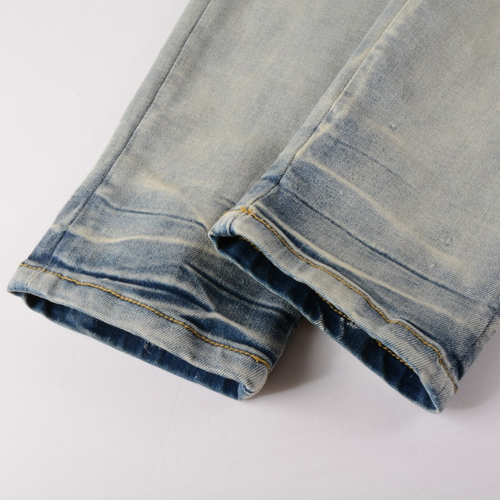 Amiri Camo Logo Jeans: Stylische Designer Stretch Denim Hose mit Tarnmuster