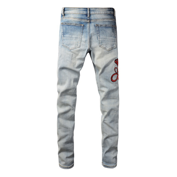 Amiri Fire Snake Jeans: Luxuriöse Designer-Denim mit feuriger Schlangenstickerei