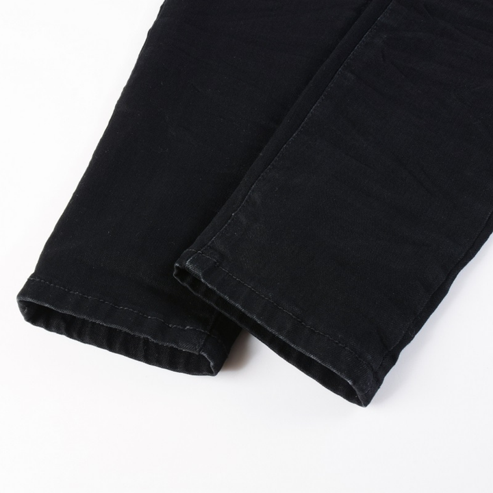 Amiri Luxus Schwarze Camouflage Jeans für Männer – Stylisch, Robust & Exklusiv