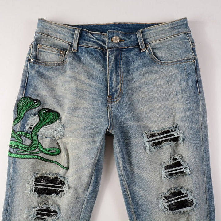 Amiri Luxus Slim Fit Snake Applikations Blue Jeans für Herren – Stylischer Denim
