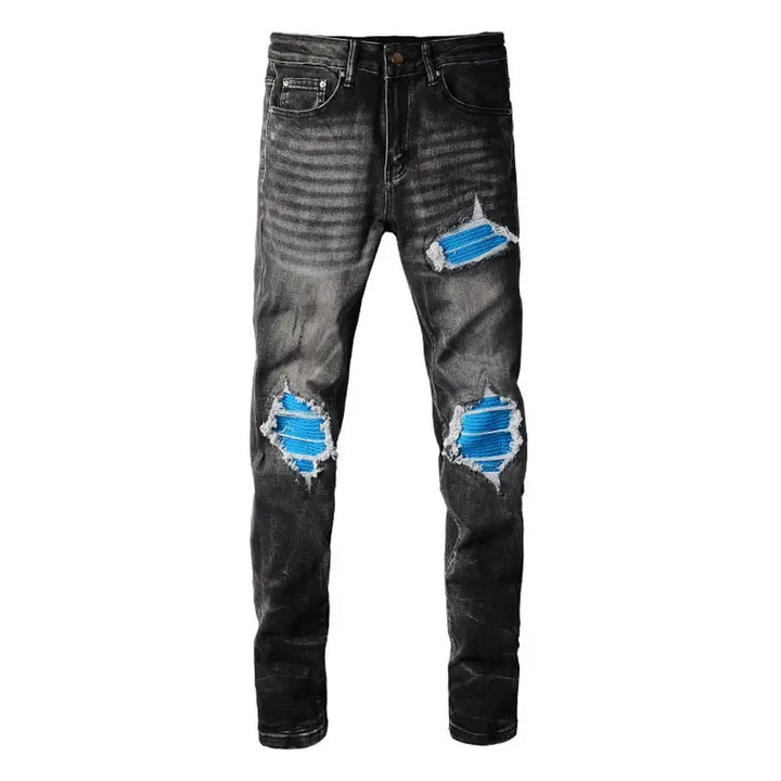 Amiri Luxus Herren Slim Fit Jeans mit auffälligen blauen Patches