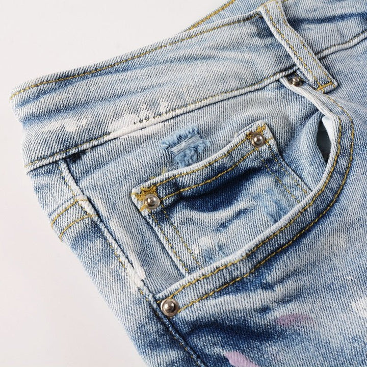 Amiri Herren Designer Jeans mit Farbspritzern – Stylische Blaue Denim Hose