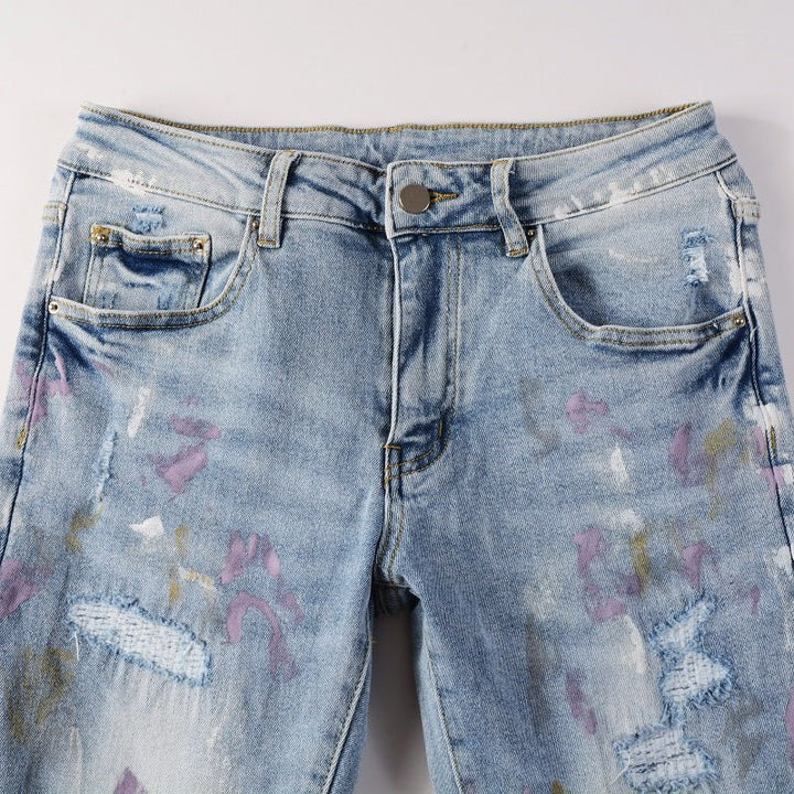 Amiri Herren Designer Jeans mit Farbspritzern – Stylische Blaue Denim Hose