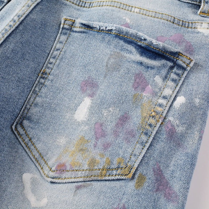 Amiri Herren Designer Jeans mit Farbspritzern – Stylische Blaue Denim Hose