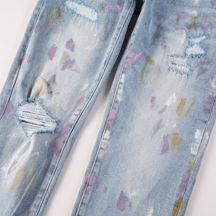 Amiri Herren Designer Jeans mit Farbspritzern – Stylische Blaue Denim Hose