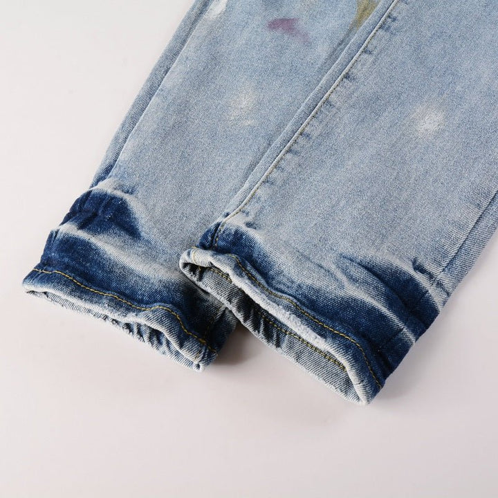 Amiri Herren Designer Jeans mit Farbspritzern – Stylische Blaue Denim Hose
