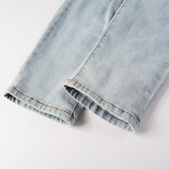 Amiri Hellblaue Patchwork Jeans für Herren – Distressed Luxus Slim Fit Denim
