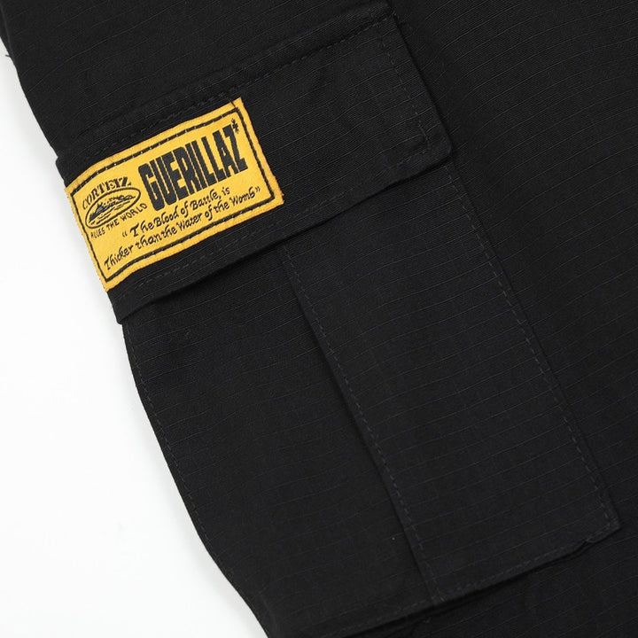 Corteiz Cargo Shorts Schwarz Gelb – Robuste Streetwear für den urbanen Look