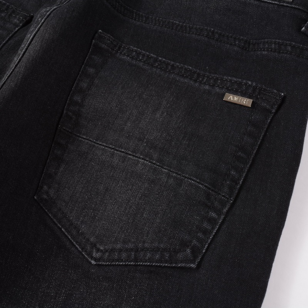 Amiri Luxus Denim Jeans: Auffällige Patches, Risse, Slim Fit Designer Stil