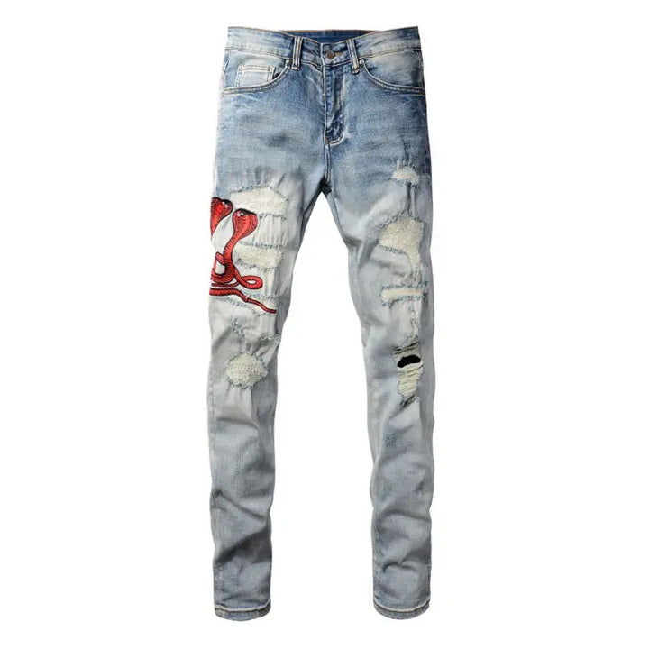 Amiri Fire Snake Jeans: Luxuriöse Designer-Denim mit feuriger Schlangenstickerei