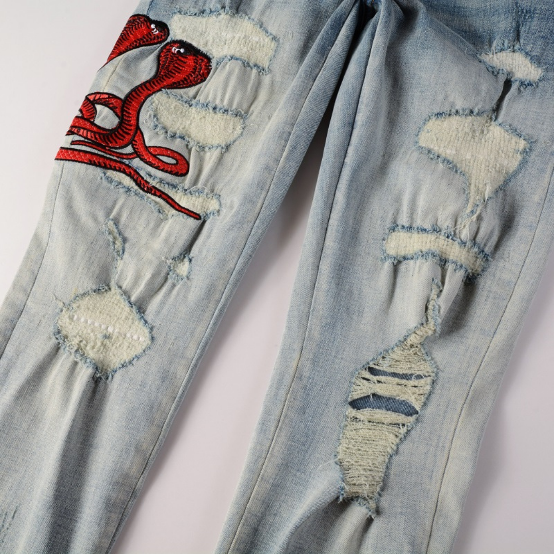 Amiri Fire Snake Jeans: Luxuriöse Designer-Denim mit feuriger Schlangenstickerei