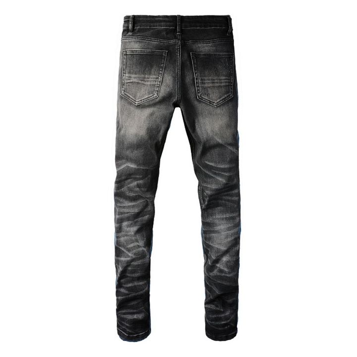 Amiri Luxus Herren Slim Fit Jeans mit auffälligen blauen Patches