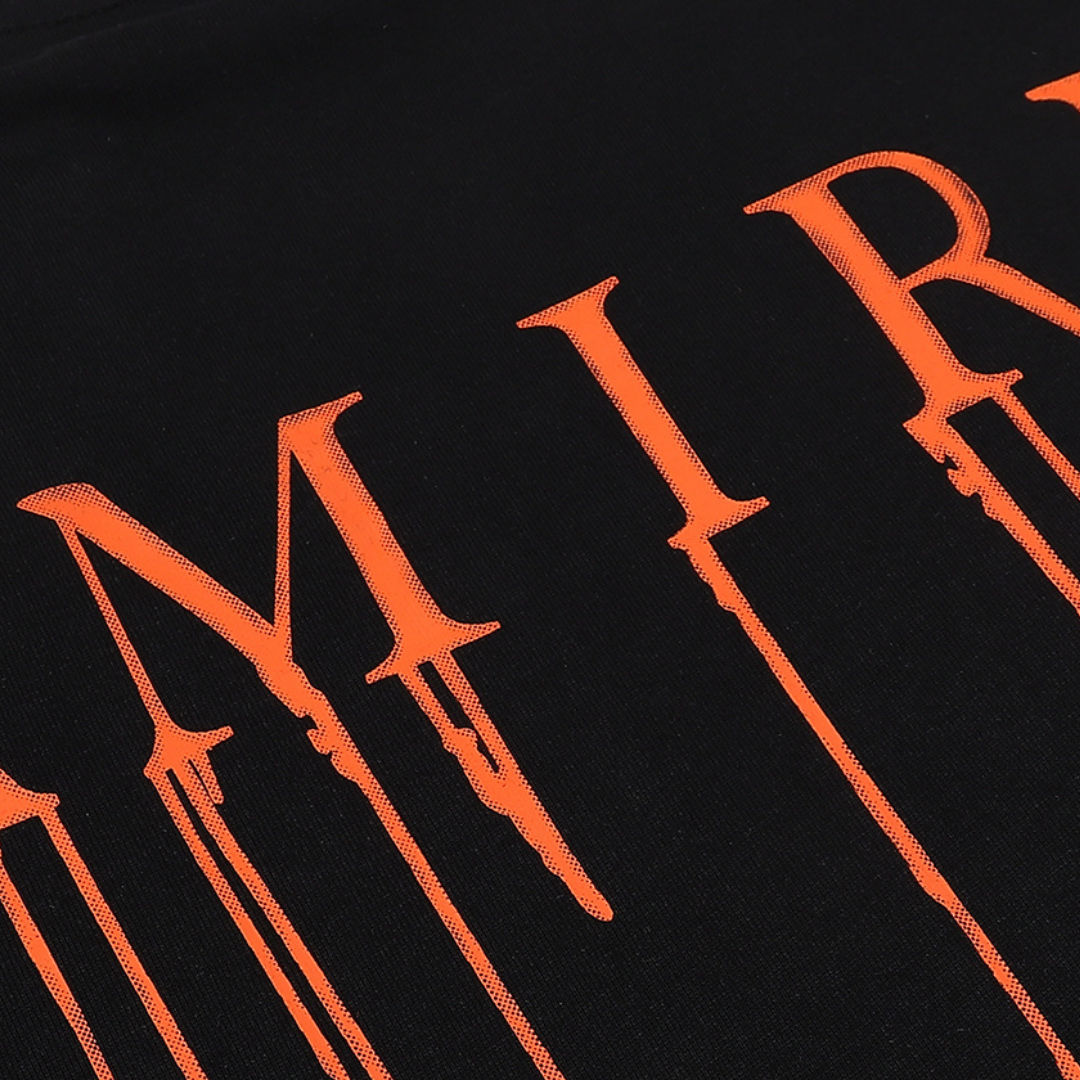 Amiri Paint Drip AM Schwarzes T-Shirt – Stylisches Designer-Shirt mit einzigartigem Farbspritzer-Design